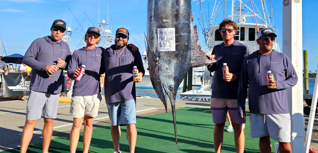 the blue marlin hanging up with the winning team Fluer Di Lis