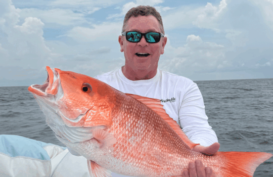 Jeff angers holding up a red snapper