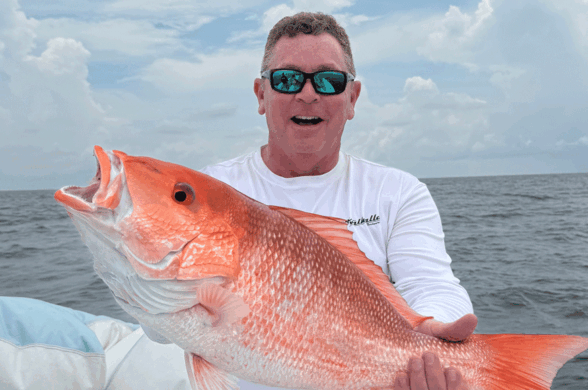 Jeff angers holding up a red snapper