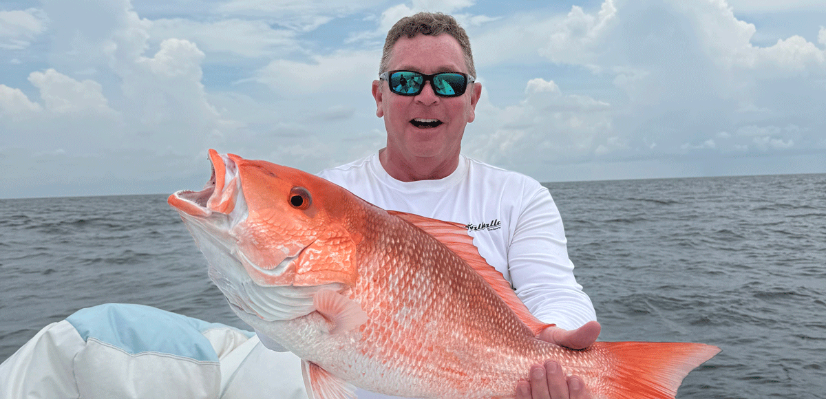 Jeff angers holding up a red snapper