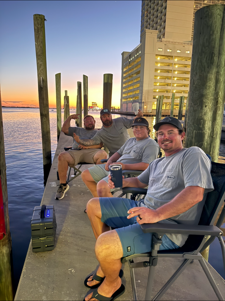 Boujee Marlin crew sitting on the dock