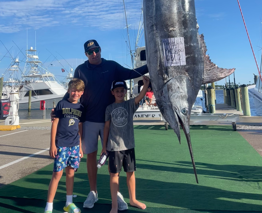 Rusty Smith blue marlin standing with his 2 boys