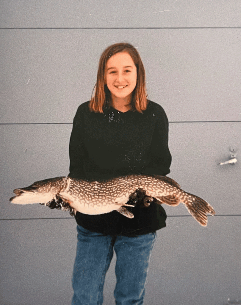 Carly Hysell from Garmin holding a muskie fish