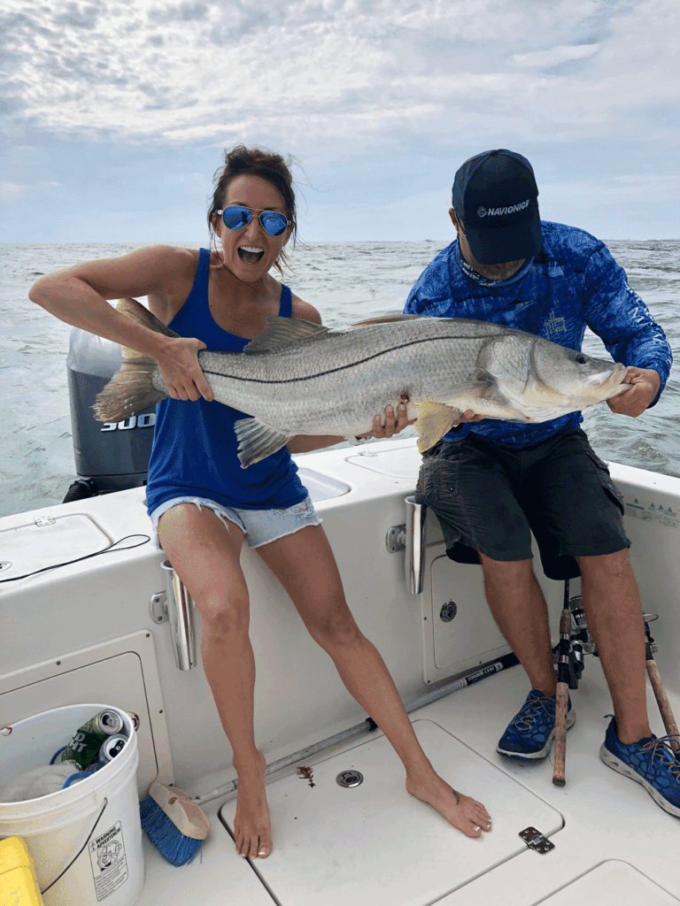 Carly Hysell from Garmin holding up a snook