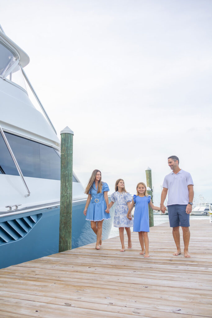 family walking down the dock