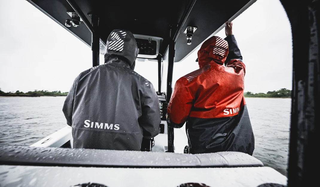 two guys wearing Simms Rip Line Pro foul weather gear