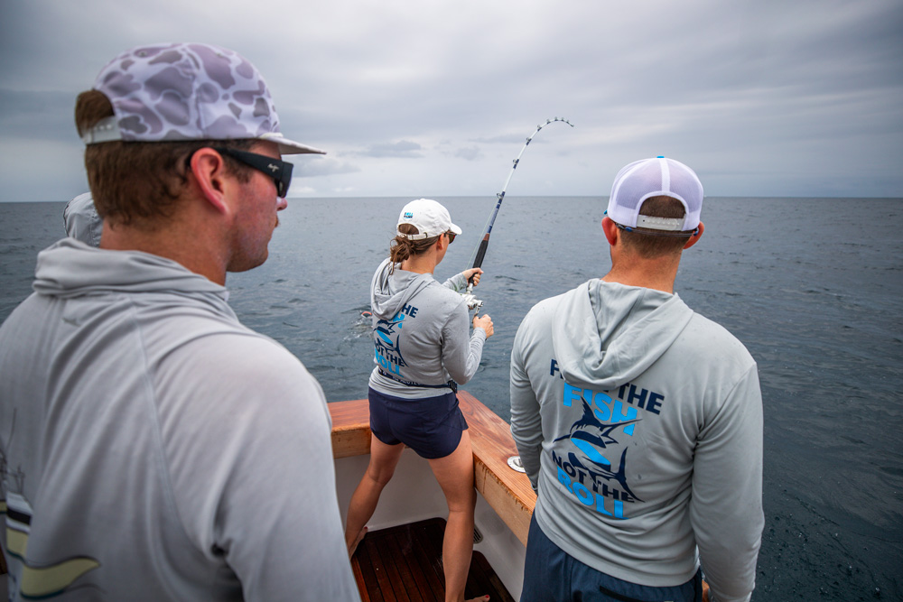 a girl fighting a sailfish