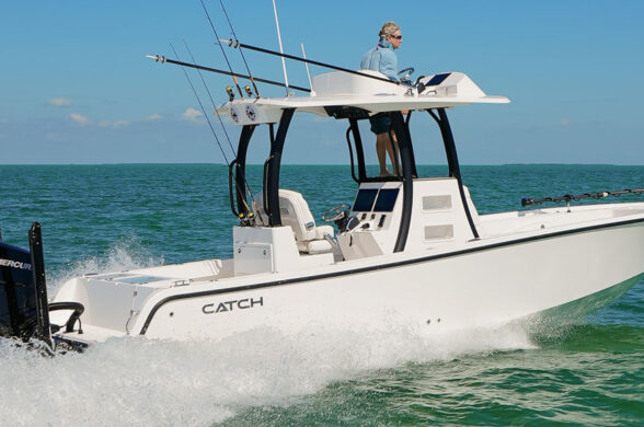 Catch boat running on the ocean with a mercury outboard