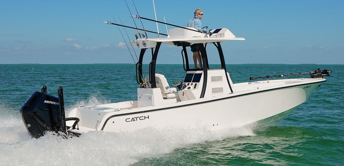 Catch boat running on the ocean with a mercury outboard